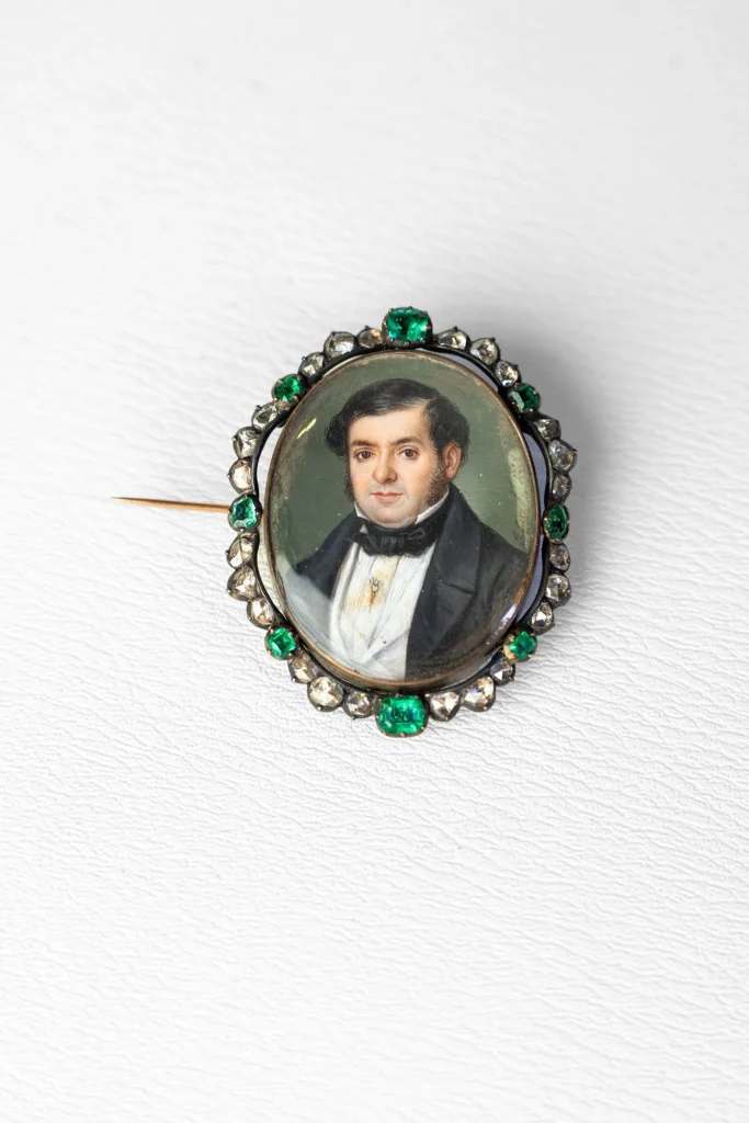 Miniature of a gentleman within a border of emeralds and old-cut diamonds.