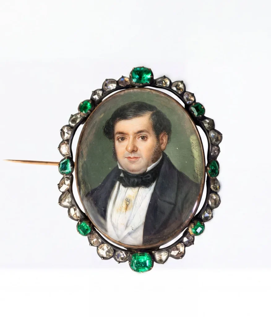 Miniature of a gentleman within a border of emeralds and old-cut diamonds.