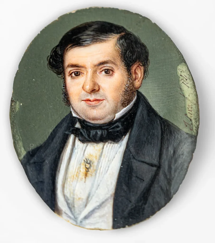 Miniature of a gentleman within a border of emeralds and old-cut diamonds.