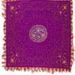 Violet silk embroidered in silver thread with birds and flowers.
