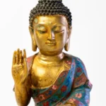 Seated Buddha, gilt face and hands, robes in cloisonné enamel.