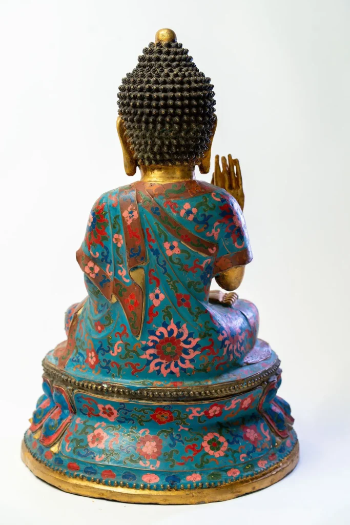 Seated Buddha, gilt face and hands, robes in cloisonné enamel.