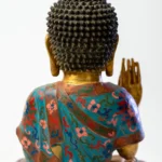 Seated Buddha, gilt face and hands, robes in cloisonné enamel.
