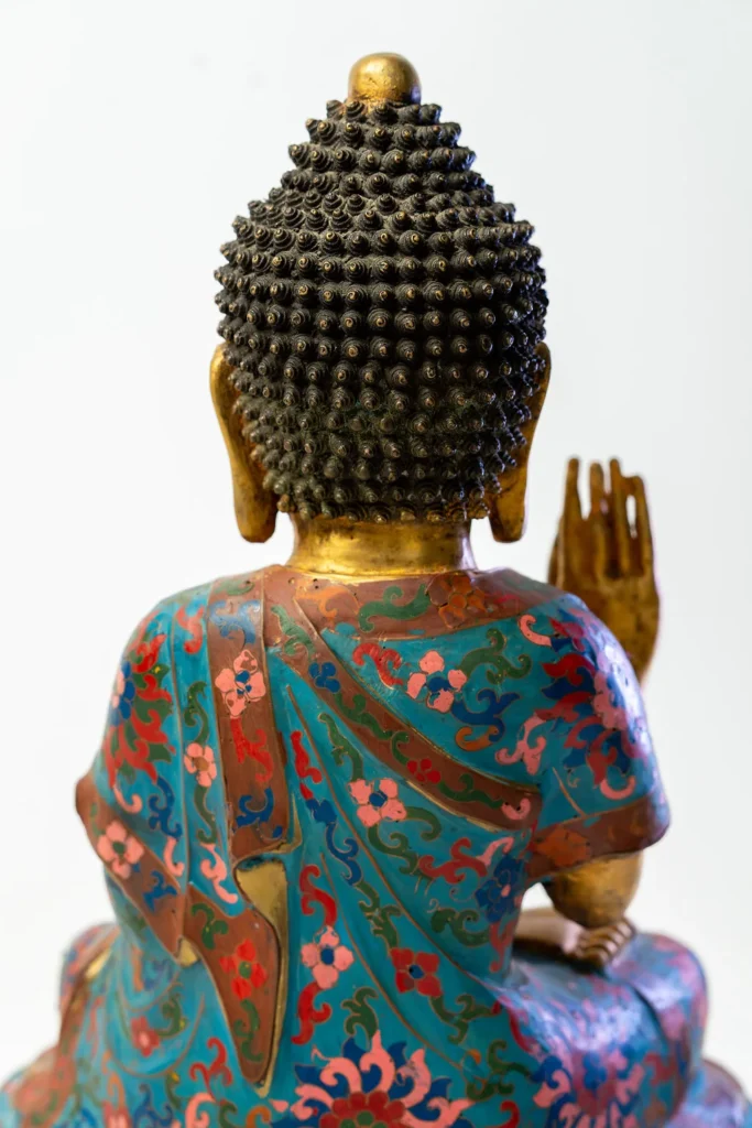 Seated Buddha, gilt face and hands, robes in cloisonné enamel.