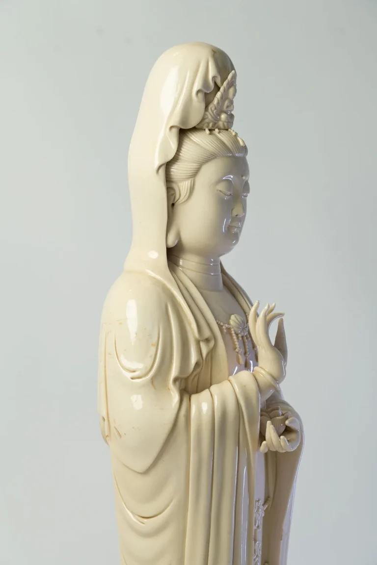 Dehua porcelain figure of Guanyin standing on a lotus base.