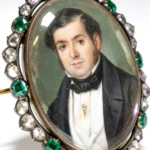 Miniature of a gentleman within a border of emeralds and old-cut diamonds.